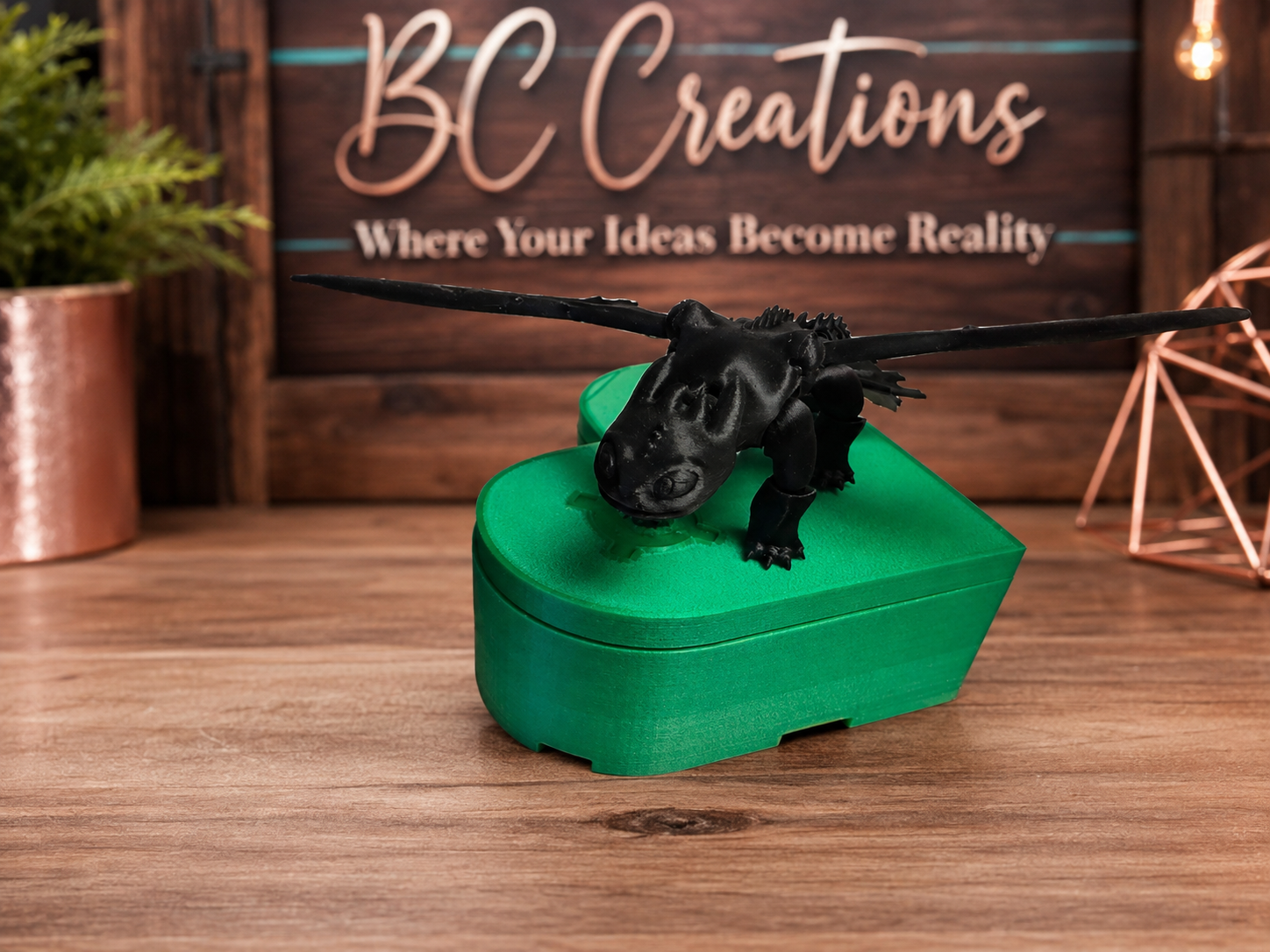 Black dragon figurine with green jewelry box