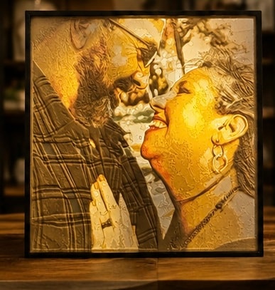 Two figures golden portrait sculpture