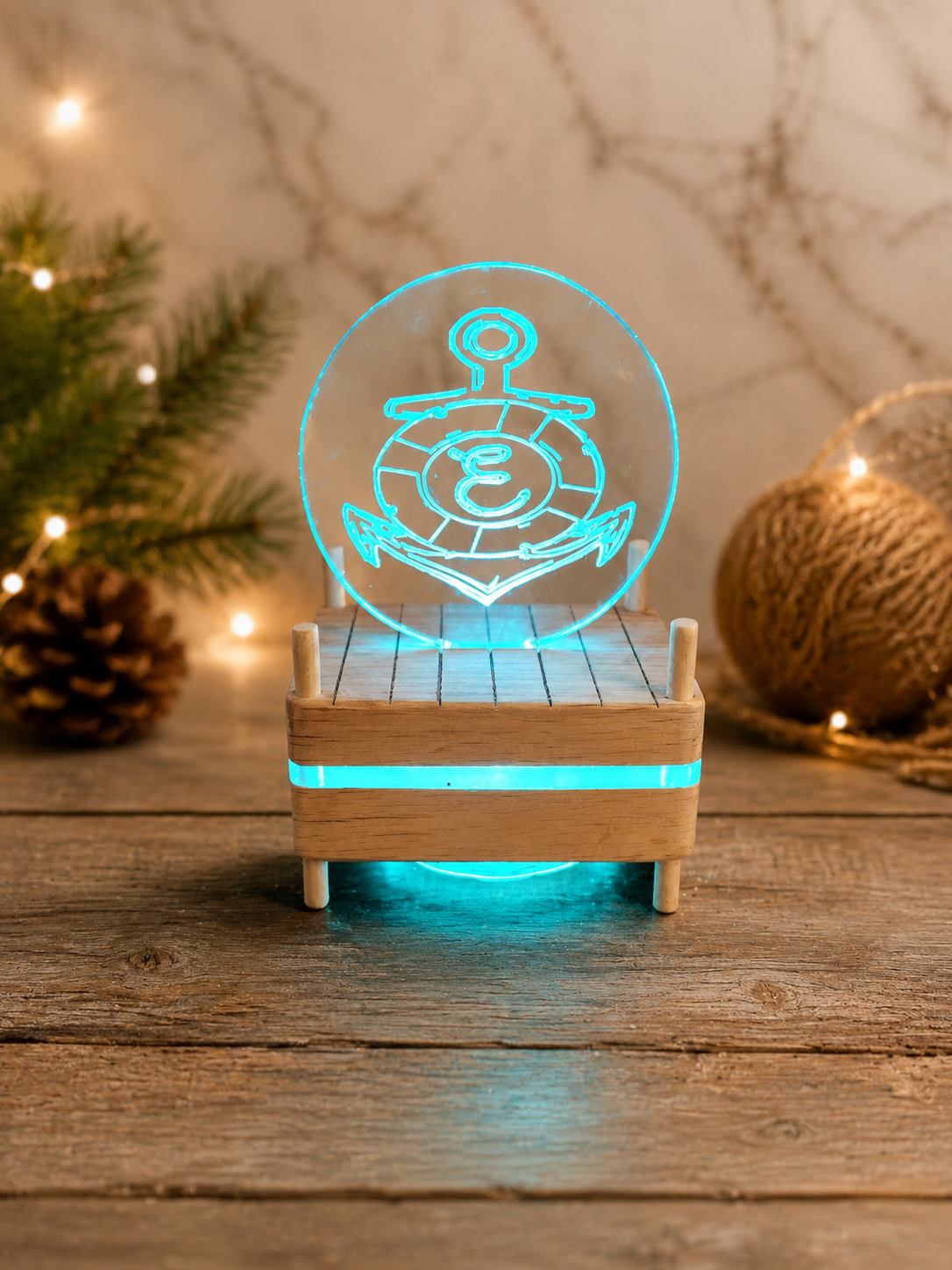 Neon anchor hologram on wooden base