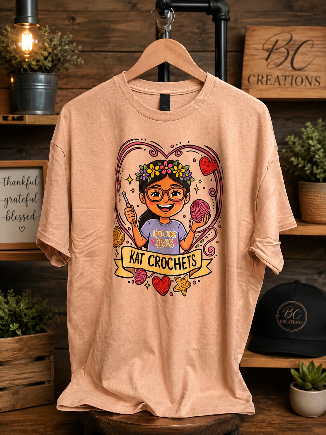 Peach t-shirt with Kat Crochets graphic design